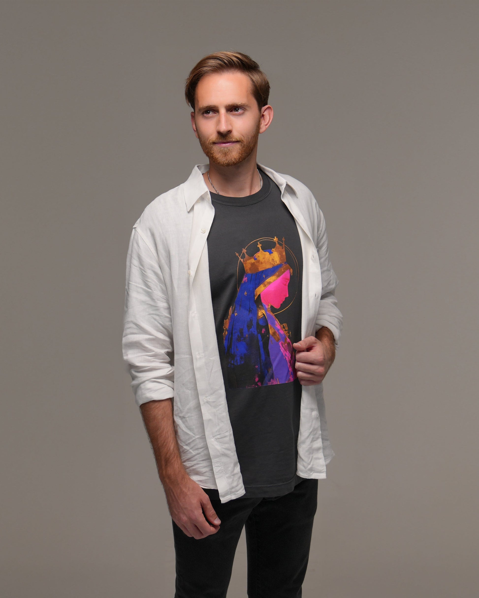 Man wearing a colorful graphic t-shirt with Mother Mary